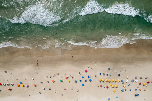 istock Beach with umbrellas and emerald green sea 1371412540