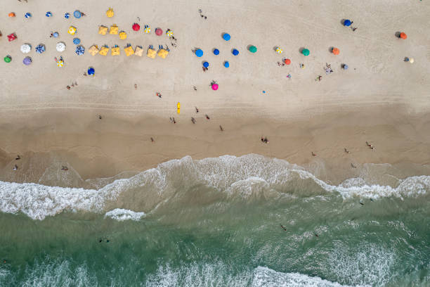 istock Beach with umbrellas and emerald green sea 1371413211