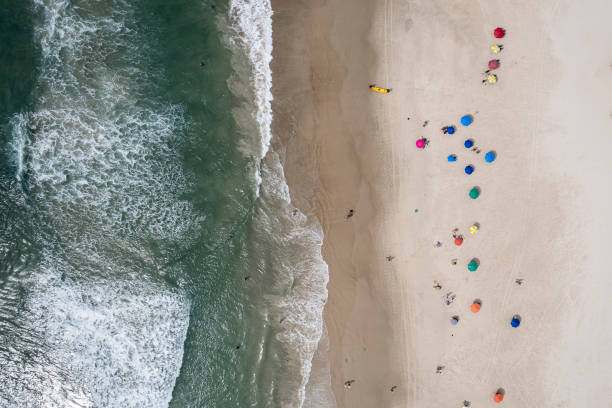 istock Beach with umbrellas and emerald green sea 1371413300
