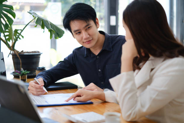 istock Group of IT consultant working by digital tablet and management big data and analyze financial document of company. 1371413308