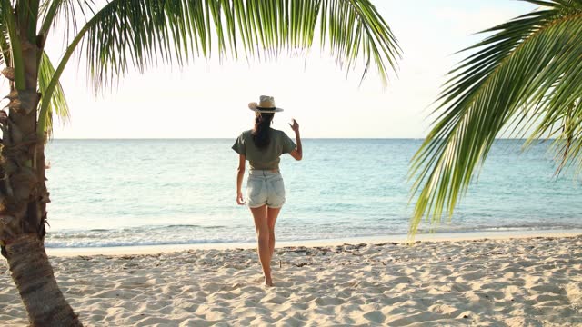 Young woman enjoys a beautiful day at the beach