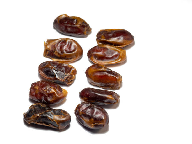 istock Dates on a white background. Delicious dried fruits. 1371425911