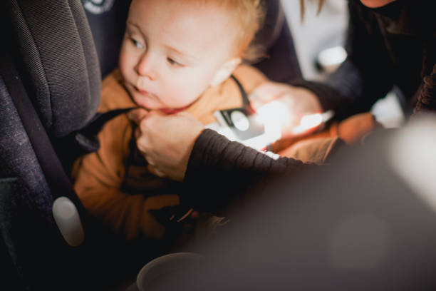 istock Baby Boy Being Buckled Into Carseat 1371427067