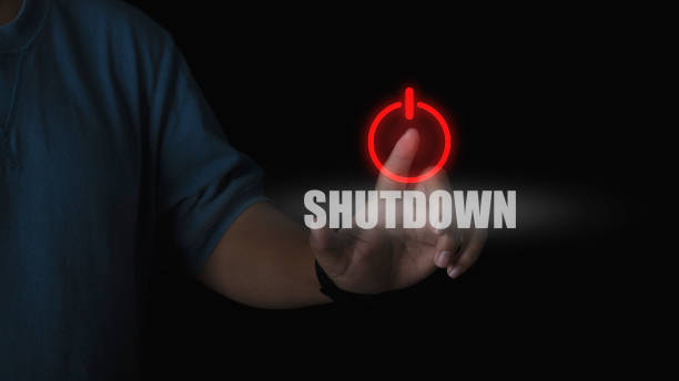 Human hand press shutdown button on virtual screen in the slide bar to unlocks. concept of system shutdown or stops working.