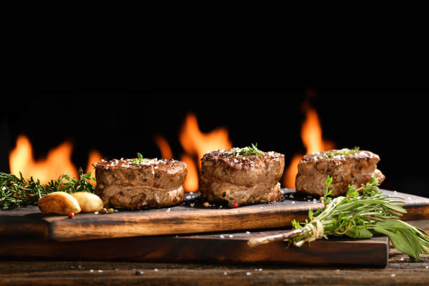 istock Cooked tenderloin on flaming background 1371431529