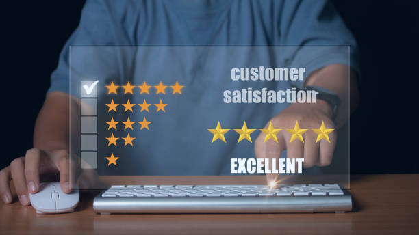 istock man hands using a laptop choosing screen on five star icon to give satisfaction in service rating very impressed. Customer service experience. 1371435471