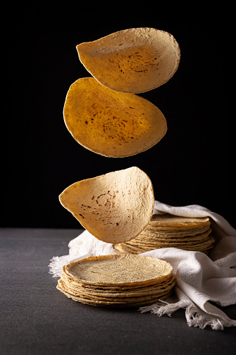 Corn Tortillas. Food made with nixtamalized corn, a staple food in several American countries, an essential element in many Latin American dishes.