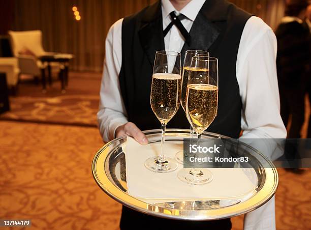 Male Waiter With Champagne Flutes Stock Photo - Download Image Now - Adult, Alcohol - Drink, Aperitif