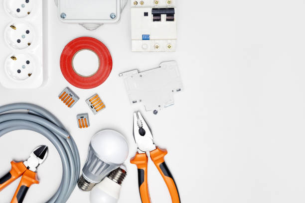 Electrician equipment and tools on white grey background with copy space. top view. Electrician equipment and tools on white grey background with copy space. top view. installation art stock pictures, royalty-free photos & images