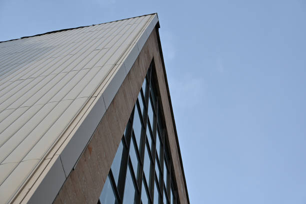 istock Geometric composition of glass and concrete against a blue cloudless sky. 1371456922