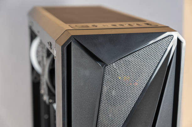 istock The front of a modern desktop computer. Black system unit in a geometric futuristic design. Digital technology. Close-up. Selective focus 1371456928