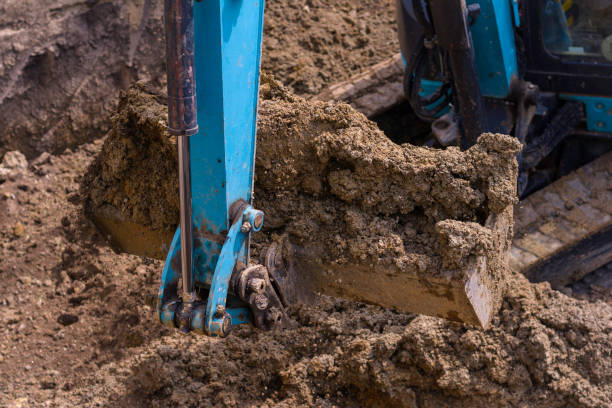 istock Close-up of excavator bucket on construction site 1371457456
