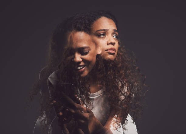 Studio shot of a young woman experiencing mental anguish and screaming against a black background It doesn’t have to take over your life bipolar disorder stock pictures, royalty-free photos & images