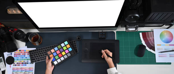 istock Female designer working modern computer and graphic tablet in creative office. 1371461775