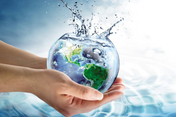 istock Man holding a water drop. safe world water day concept 1371464904