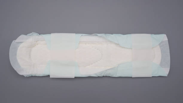 istock Sanitary napkin with wing for night use on gray background. 1371466561