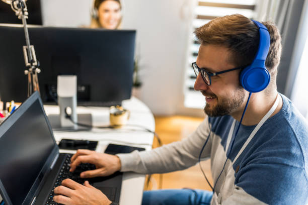 istock Young couple doing business together working at home on the computer. 1371466661