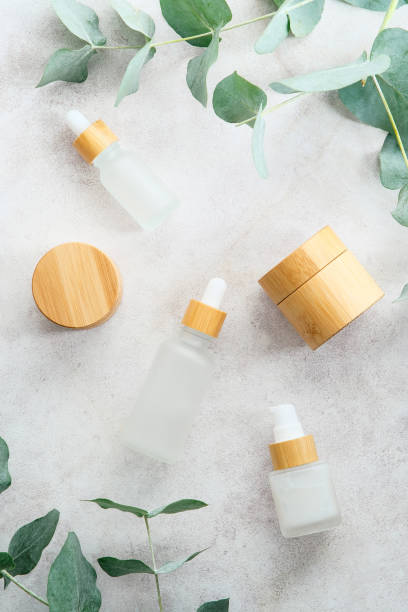 istock Natural cosmetics set on stone table with eucalyptus leaves. Flat lay, top view. 1371470587