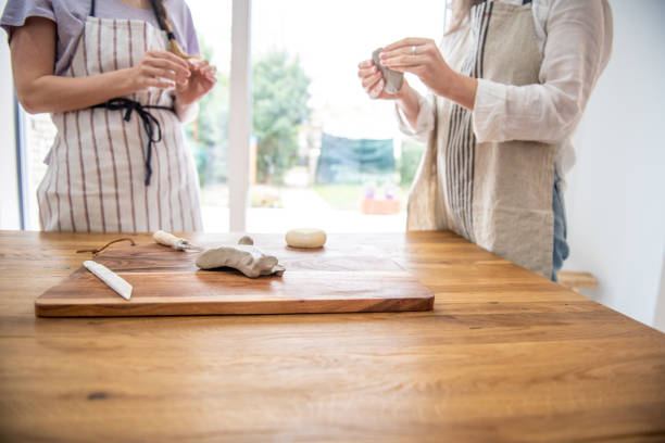 istock Women creating with clay at home 1371472130