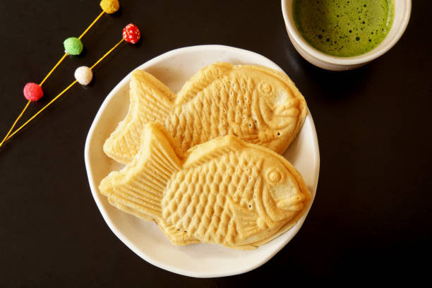 istock Taiyaki is a fish-shaped waffle filled with red bean paste inside. 1371476952