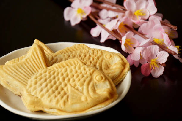 istock Taiyaki is a fish-shaped waffle filled with red bean paste inside. 1371477024
