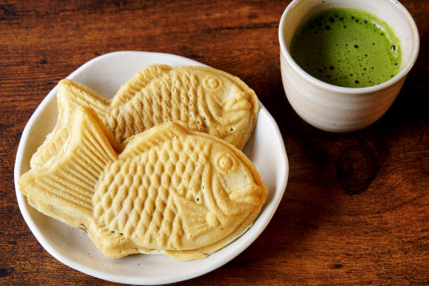 istock Taiyaki is a fish-shaped waffle filled with red bean paste inside. 1371477052