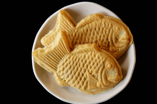 istock Taiyaki is a fish-shaped waffle filled with red bean paste inside. 1371477578