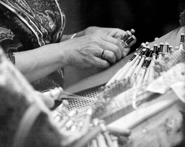 istock Bobbin lace manufacturing, senior w 1371477638
