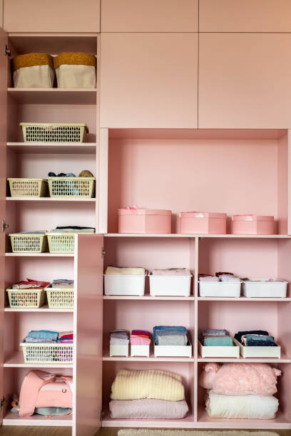 istock Female kid pink closet with comfortable vertical storage clothes organization case box 1371477813