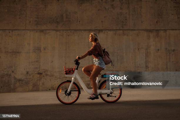 Having The Time Of Her Life Stock Photo - Download Image Now - Electric Bicycle, City, Cycling