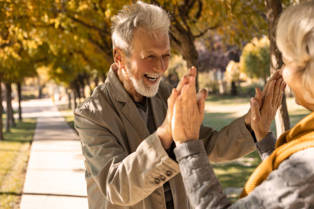 istock Senior couple meeting in park 1371482285