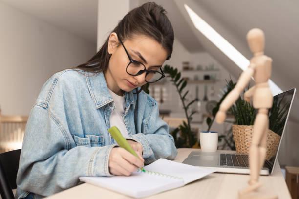istock Young woman learning online from home 1371483881