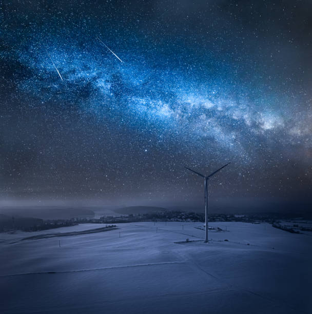istock Milky way over field in winter. Winter sky at night. 1371490827