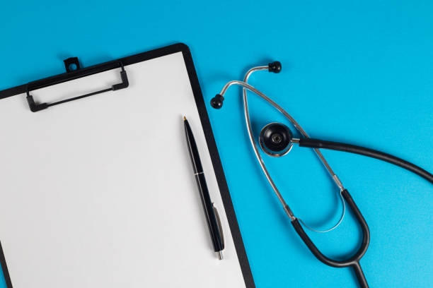 istock Treatment plan for a patient, doctor's desk top view. 1371496304