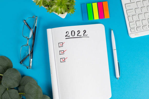 istock To do list for 2022 in notebook plan. Top view, flat lay, copy space. 1371496315