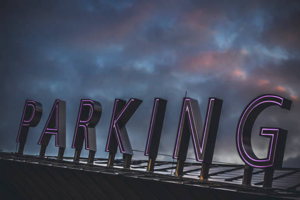 ROTTERDAM, THE NETHERLANDS - OCTOBER 21, 2018: Neon Parking Sign stock photo