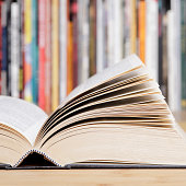 istock Open book close up at the library 1371497578