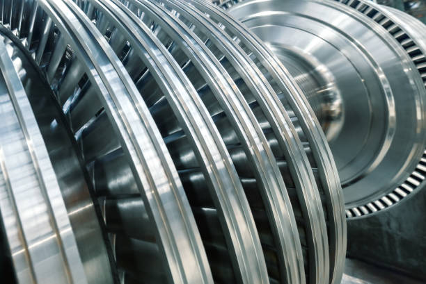istock Steam turbine with silver blades in brightly lit workshop 1371498955