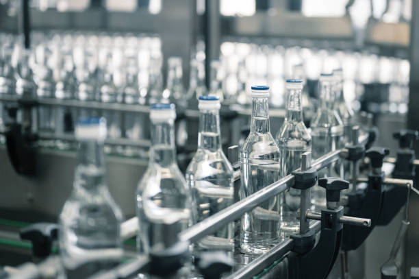 istock Production line transports empty glass bottles for alcohol 1371500254