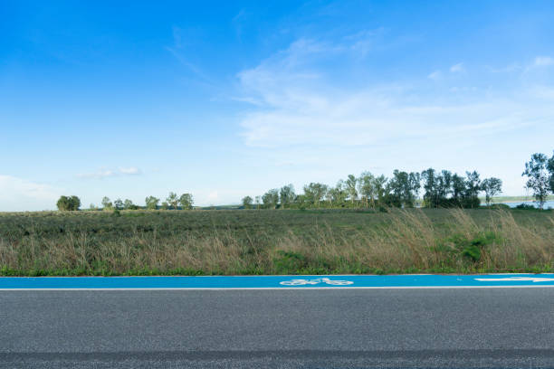 Horizontal and Landscape view of beside asphalt road with bike lens blue color. stock photo