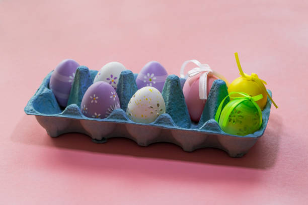 istock Easter egg as decoration. The Easter egg is in the egg carton. The background is monochrome. 1371503439