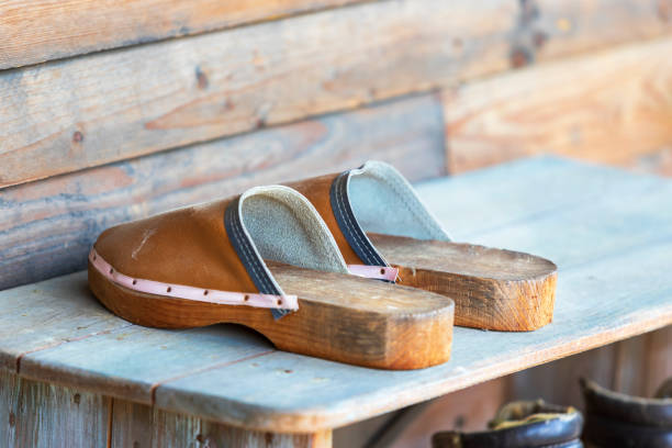 istock Old clogs lie on a farm on 1371504153