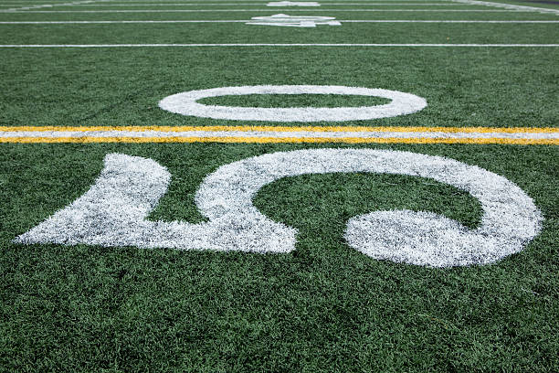 istock Football stadium 50 yard line artificial grass and markings 137150510