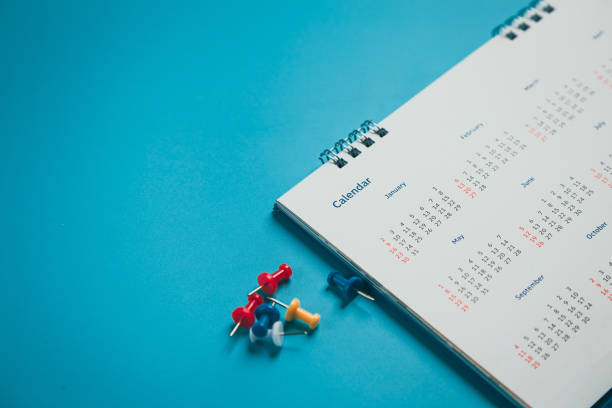 istock Close top view on white calendar 2022 month schedule Work planning and life concept. 1371511444