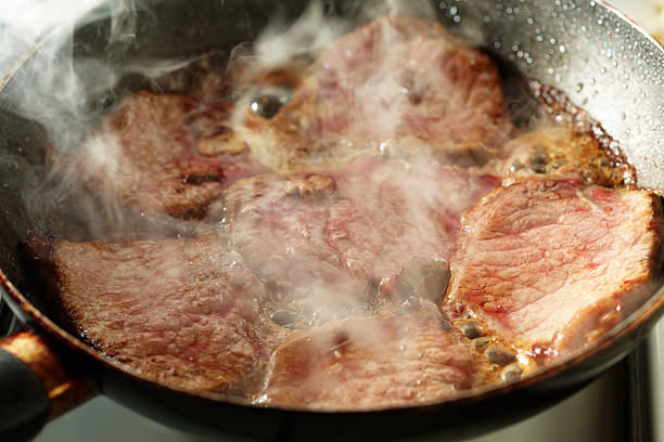 istock Frying veal in a pan with vapour 137151146