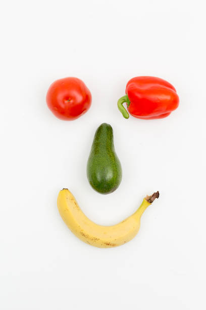 istock a face made of vegetables on a white background 1371513347