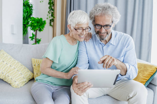 istock A mature couple uses a digital tablet at home 1371514718
