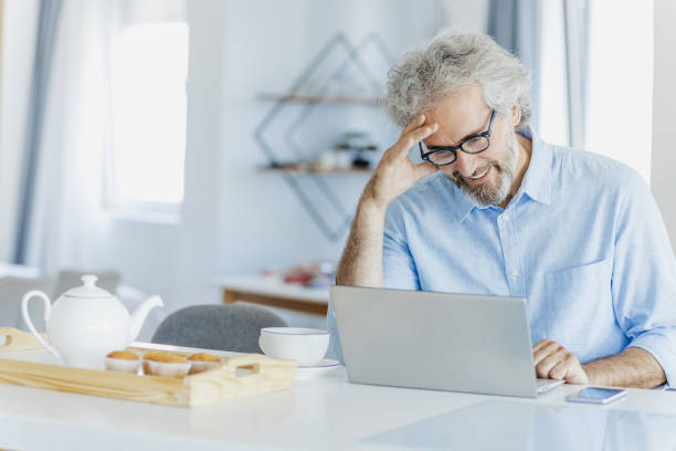 istock Stressful day and working from home for mature man 1371514780