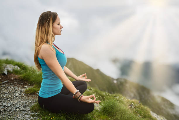 istock Yoga woman on mountain 1371515212