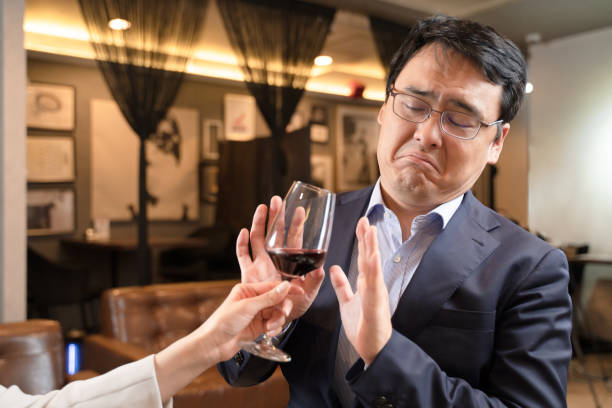 istock Men receiving alcohol harassment from women 1371516656